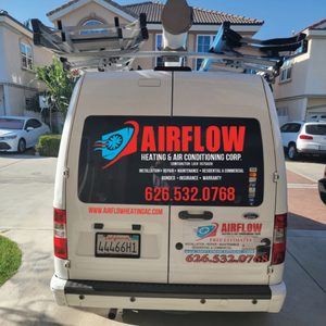 AirFlow Heating & Air Conditioning Corp. service van parked at a residential job